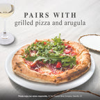 A fresh grilled pizza topped with arugula and red peppers on a white plate, with a glass of white wine and the text 'PAIRS WITH grilled pizza and arugula' on a light gray background.