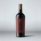 A bottle of Harvey & Harriet Cabernet Sauvignon Red Wine, featuring a dark burgundy label with gold lettering and a gold foil seal on a gray background.