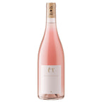A bottle of Harvey & Harriet rose wine with a white label and a cork with logo on it, shown against a plain white background. 