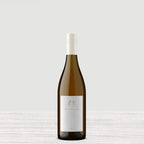 A single bottle of Harvey & Harriet White with a white label and a white capsule cap, centered against a white textured background.