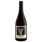 A bottle of The Prisoner Pinot Noir red wine, featuring a dark glass bottle with a black cap and a cream-colored label with a dark, textured graphic.